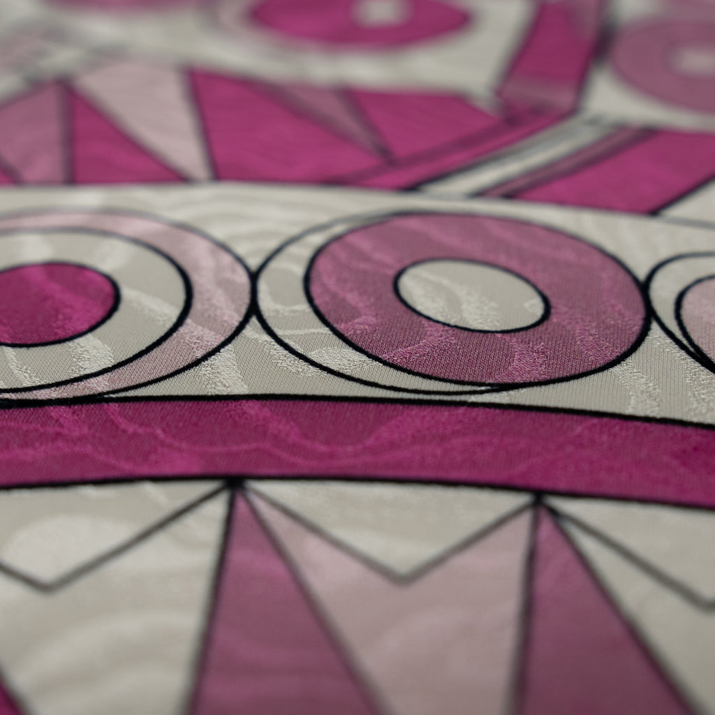 Close-up of a pink and gray geometric patterned fabric