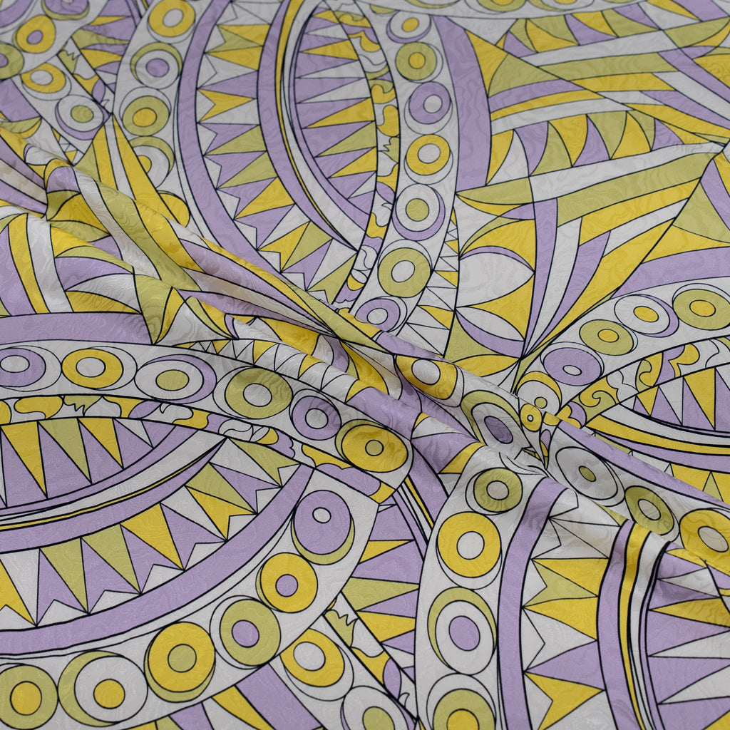 Geometric pattern with purple and yellow colors on a fabric background