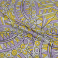 Geometric pattern with purple and yellow colors on a fabric background