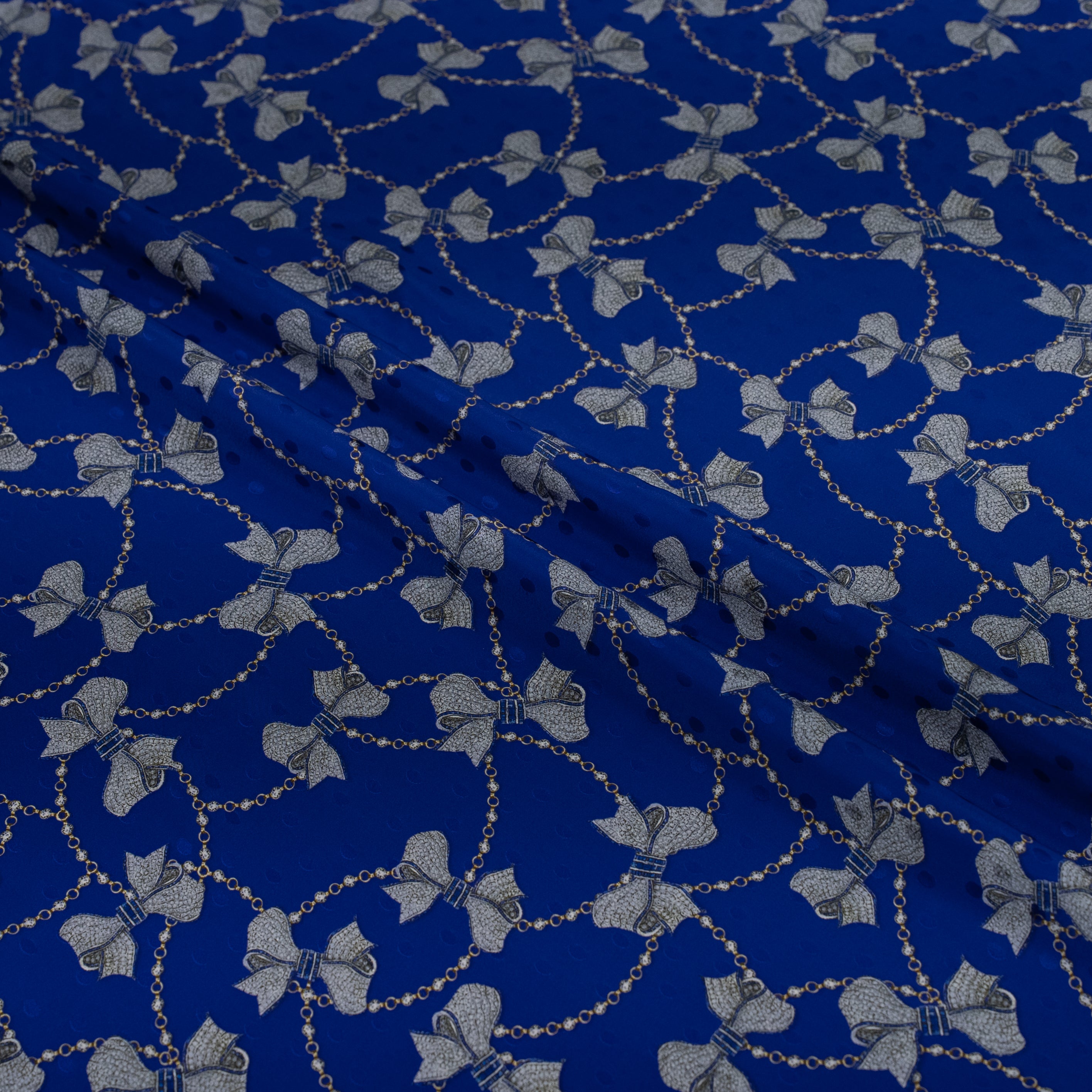 Blue fabric with silver jewel pattern