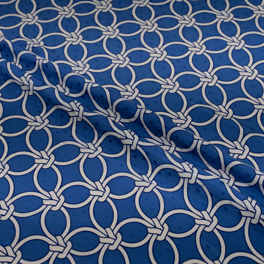 Blue fabric with white geometric pattern