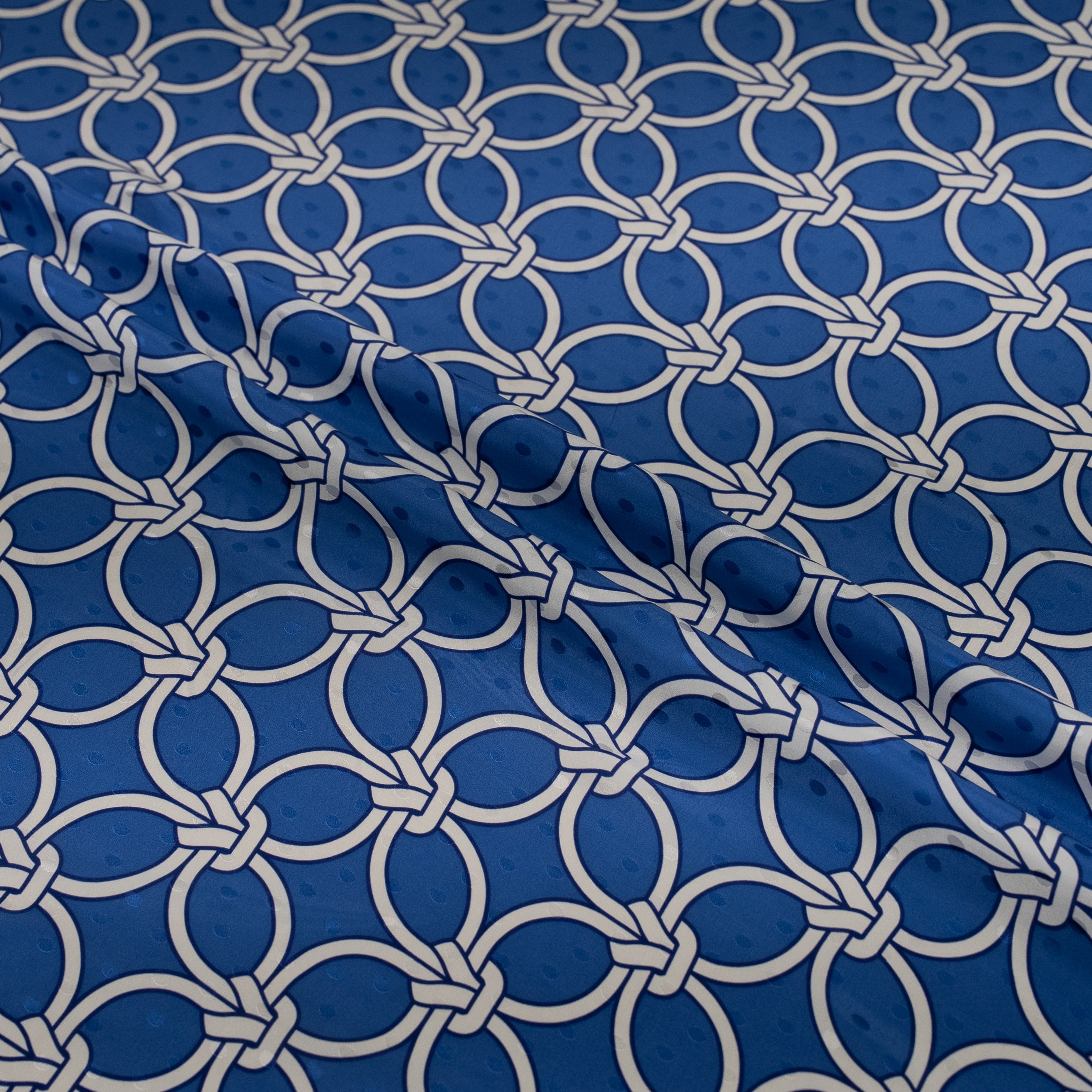 Blue fabric with white geometric pattern