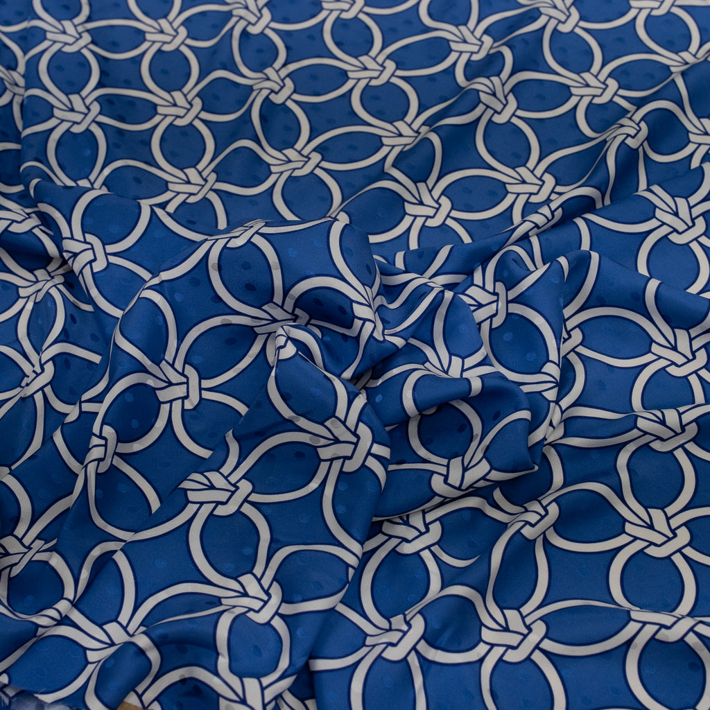 Blue fabric with white geometric pattern