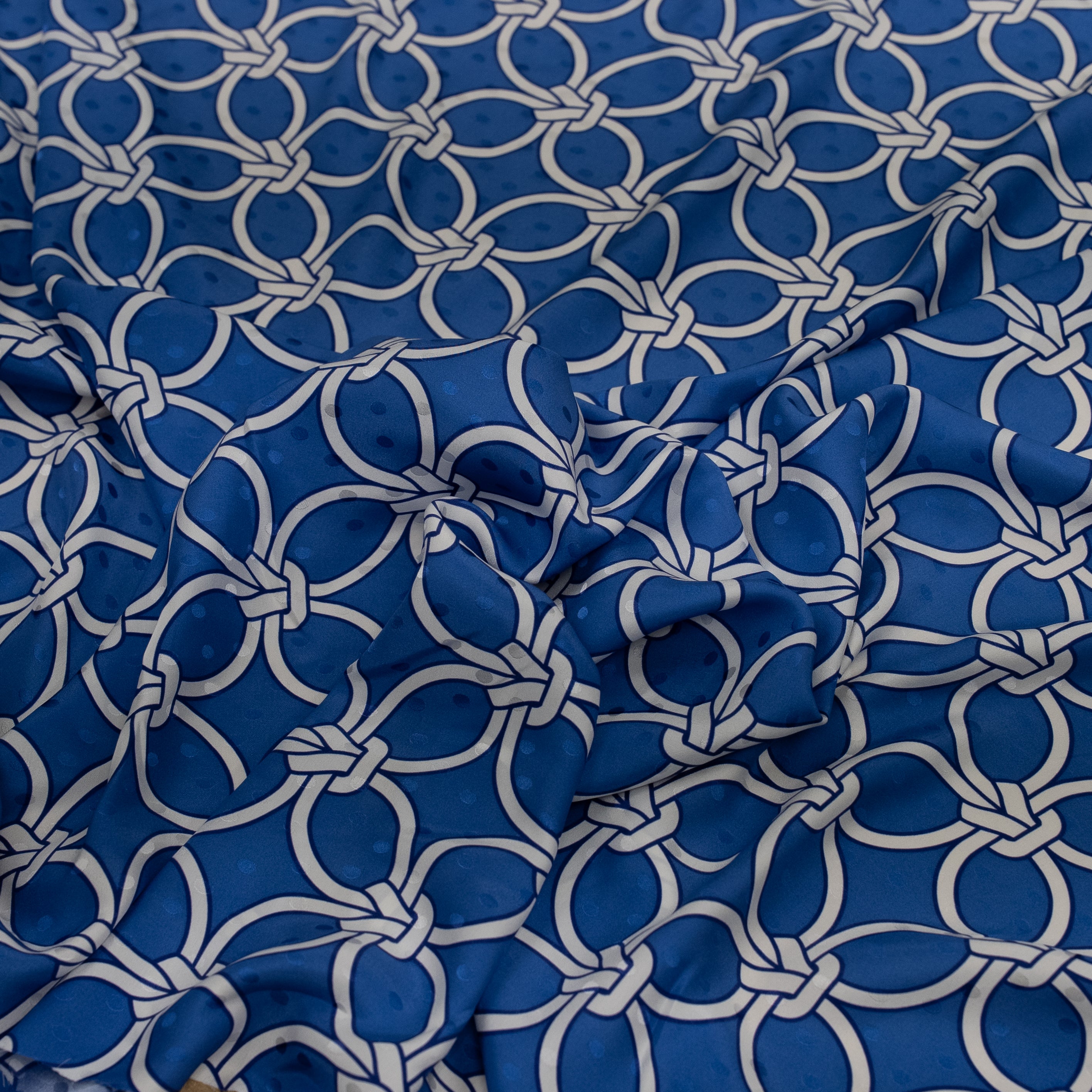 Blue fabric with white geometric pattern