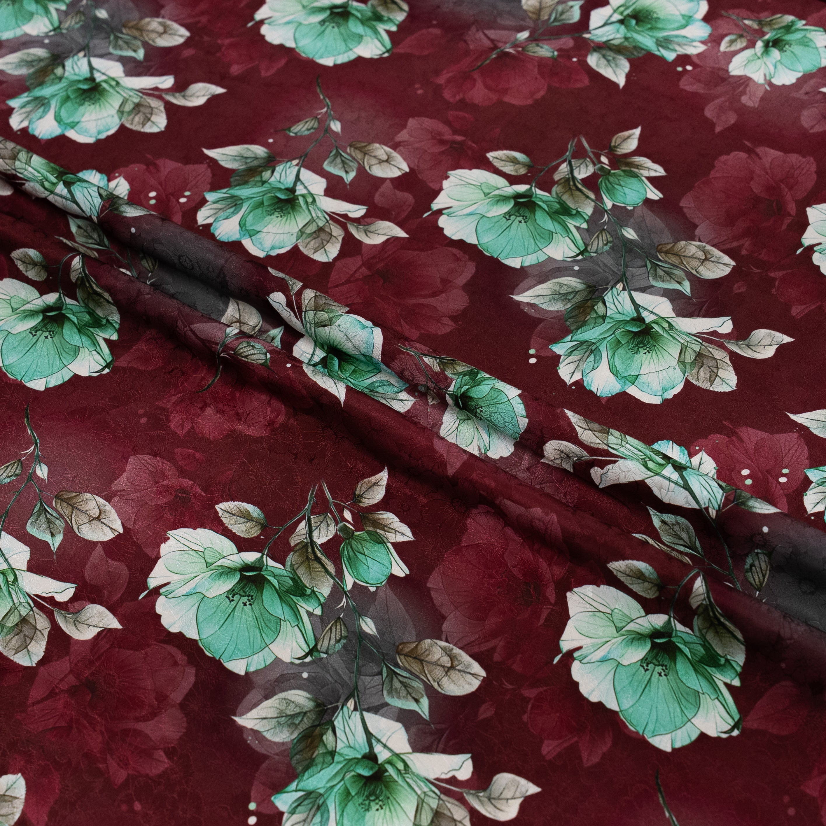 Floral fabric with green flowers on a red background