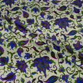 Floral patterned fabric with purple and green flowers on a white background