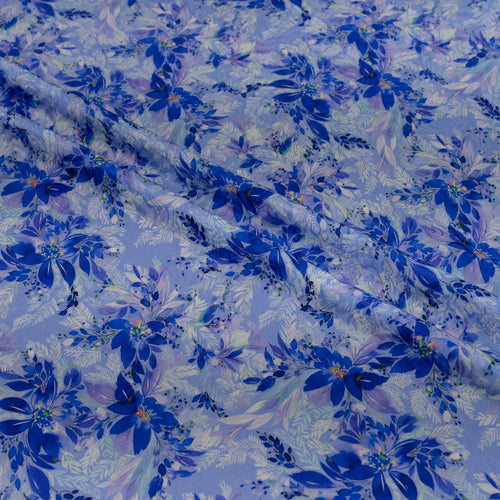 Floral patterned fabric with blue flowers on a light background