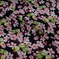 Floral pattern with pink and white flowers on a black background
