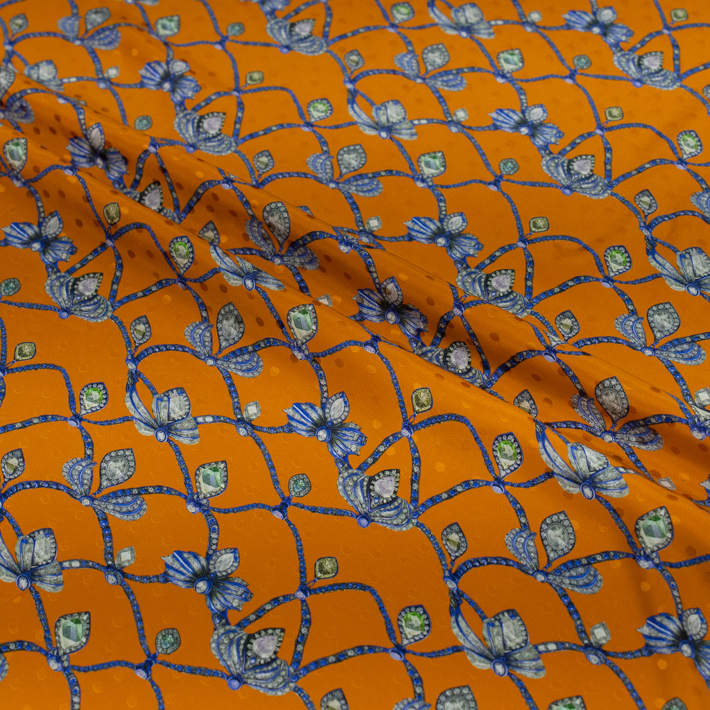 Orange fabric with blue jewel pattern