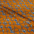 Orange fabric with blue jewel pattern