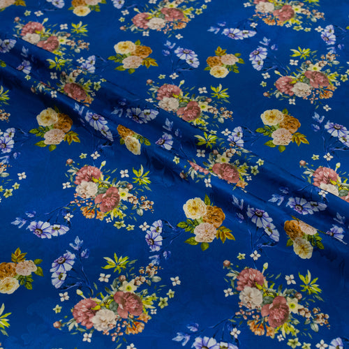 Floral patterned fabric with colorful flowers on a blue background