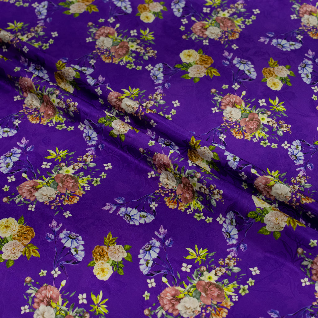 Floral pattern on purple silk fabric