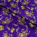 Floral pattern on purple silk fabric