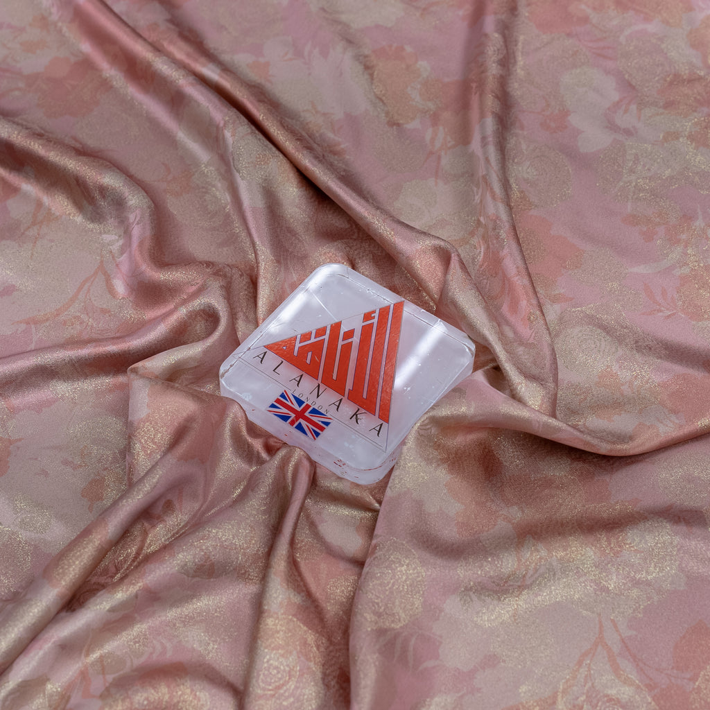 alanaka branded product on a pink floral fabric background