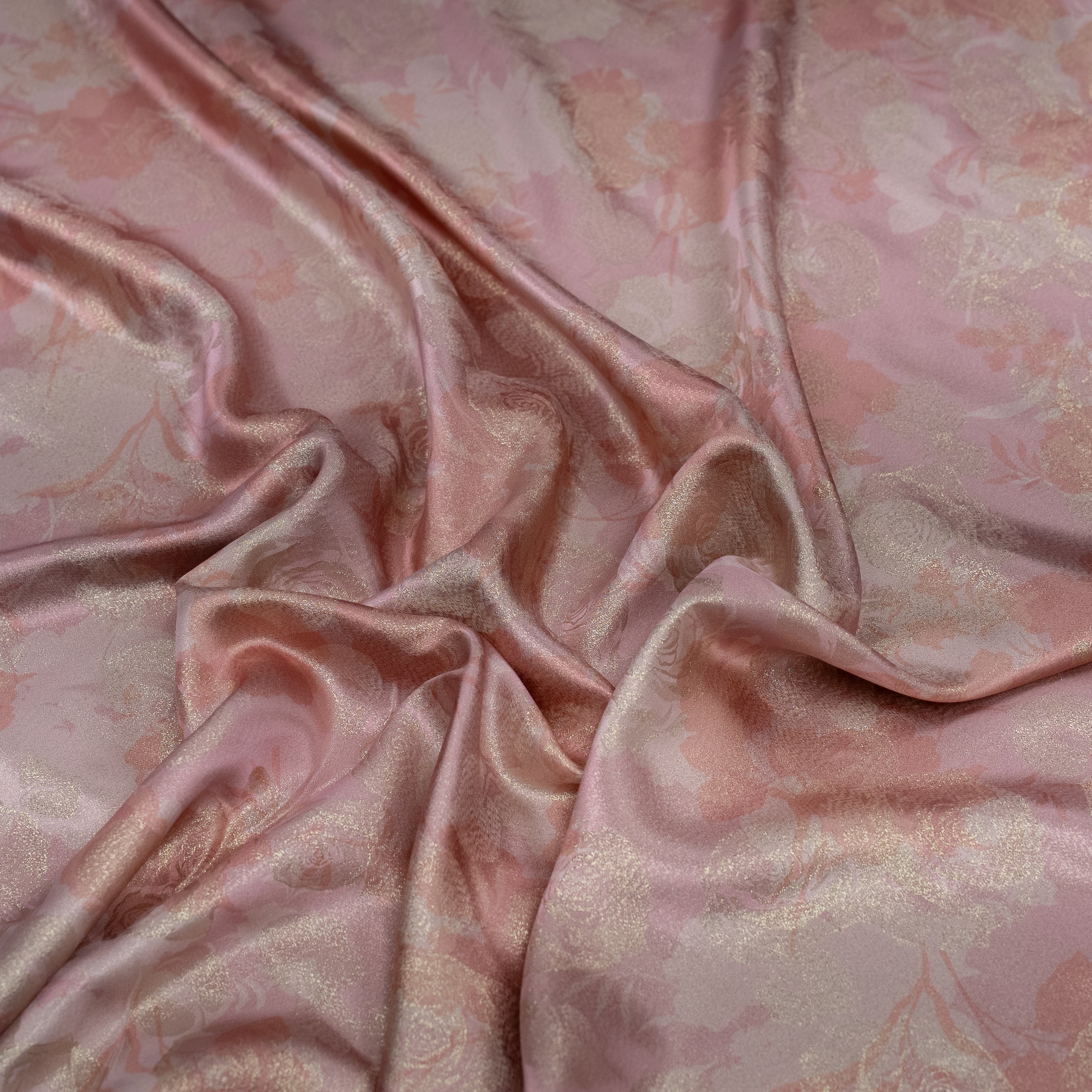 Pink floral patterned fabric with a satin finish
