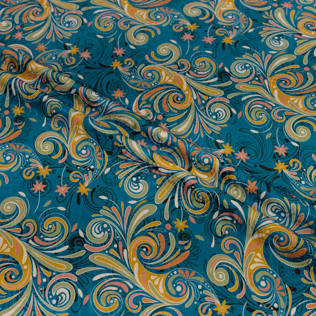 Colorful swirl pattern fabric with blue background